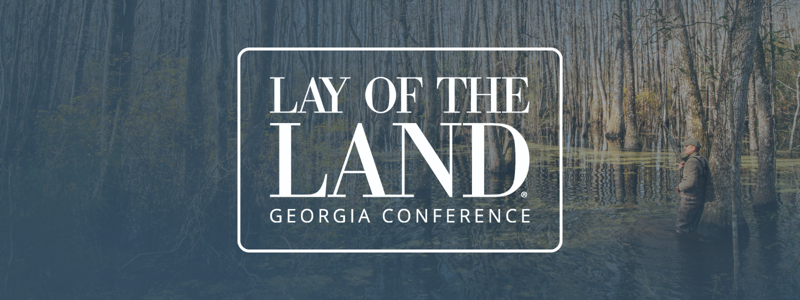 georgia land conference logo over some young pine stands