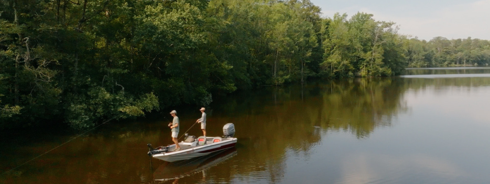 two men fishing on a river in georgia